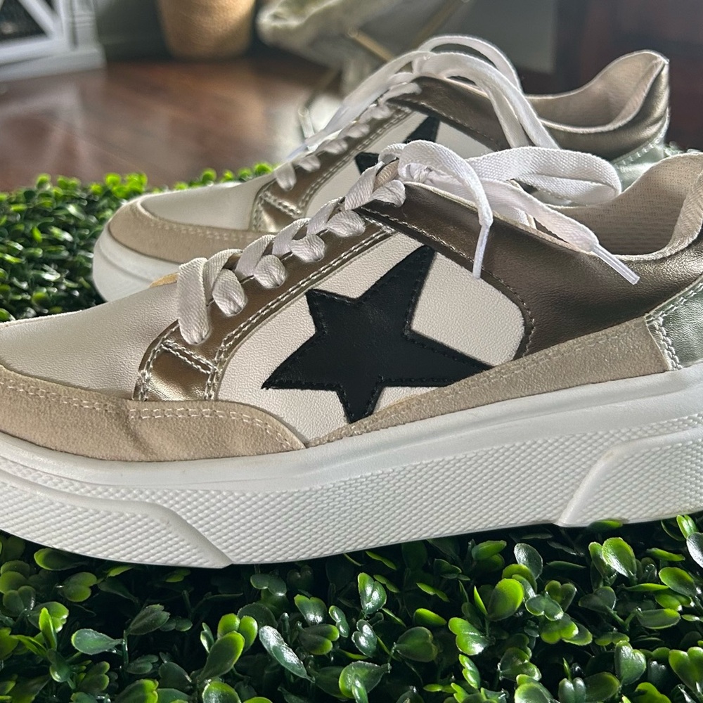 White and Black Sneakers with Retro-Inspired Design